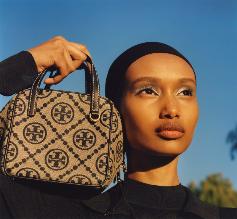 Ugbad Abdi featured in  the Tory Burch advertisement for Spring/Summer 2023