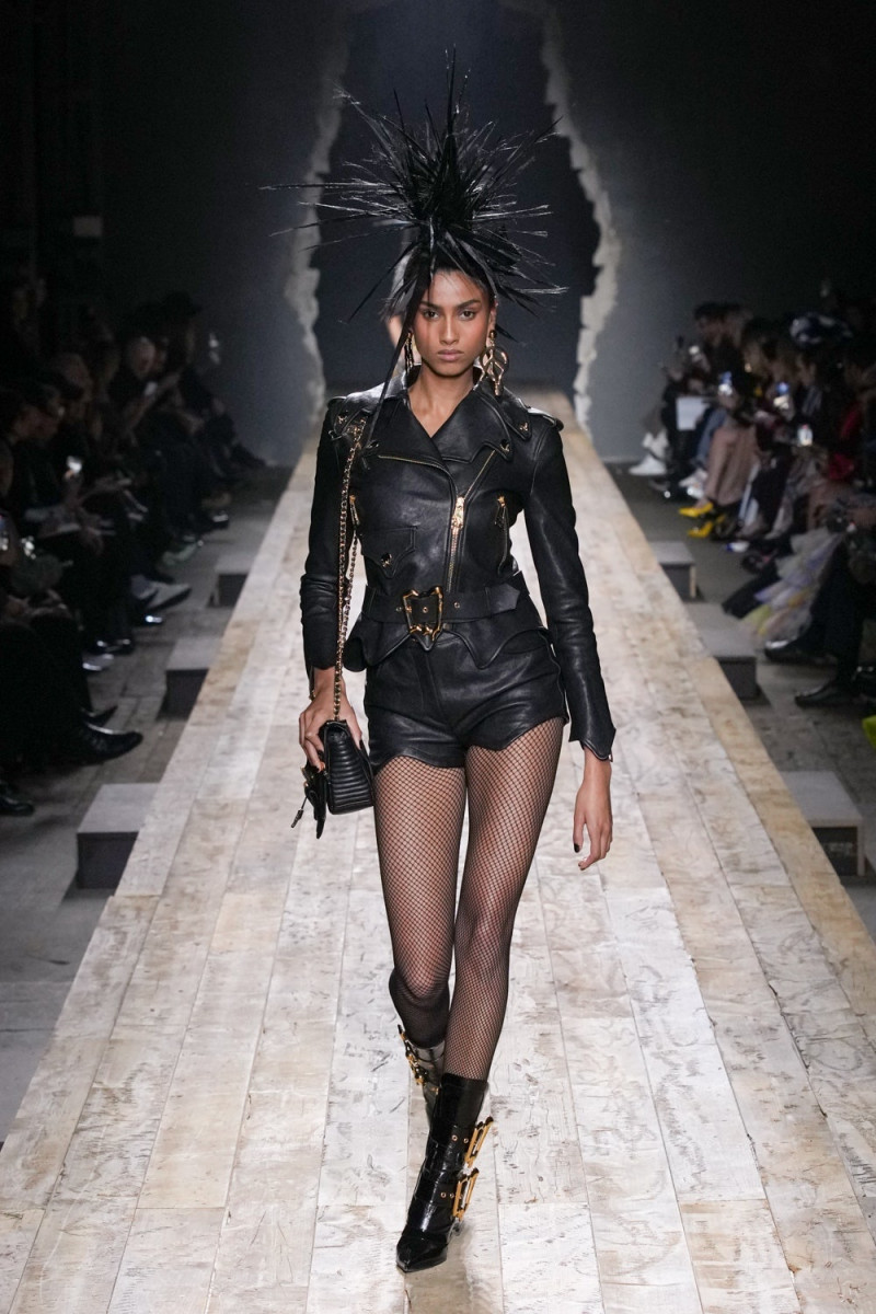 Imaan Hammam featured in  the Moschino fashion show for Autumn/Winter 2023