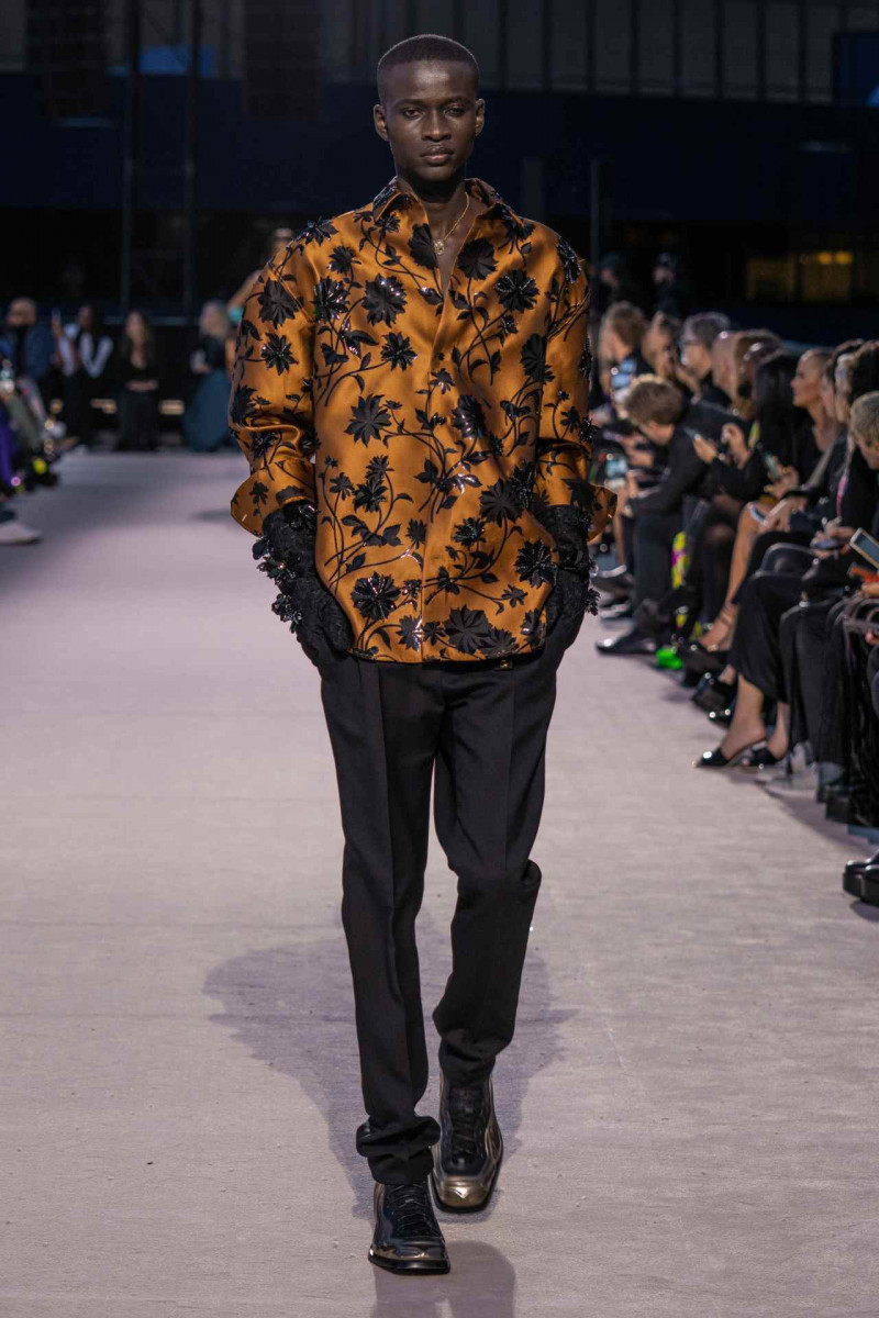 Serigne Lam featured in  the Versace fashion show for Autumn/Winter 2023