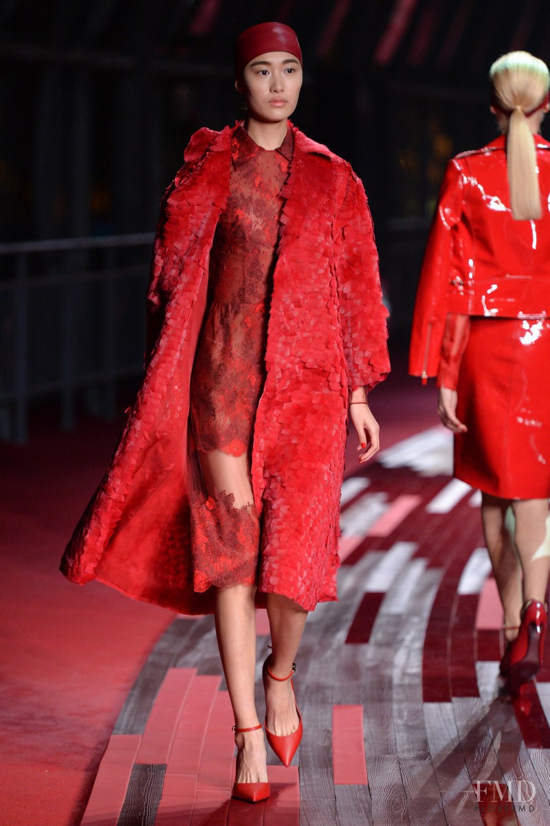 Shu Pei featured in  the Valentino Red Collection fashion show for Spring/Summer 2013