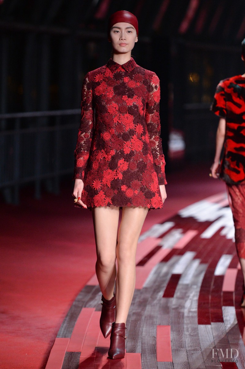 Ren Hui featured in  the Valentino Red Collection fashion show for Spring/Summer 2013