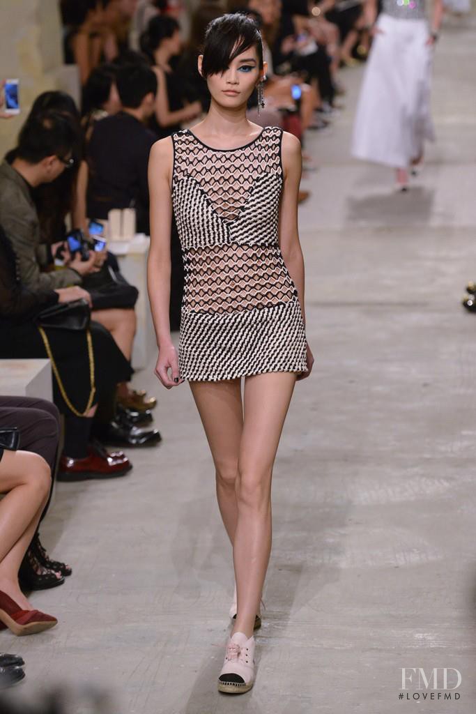 Ming Xi featured in  the Chanel fashion show for Cruise 2014