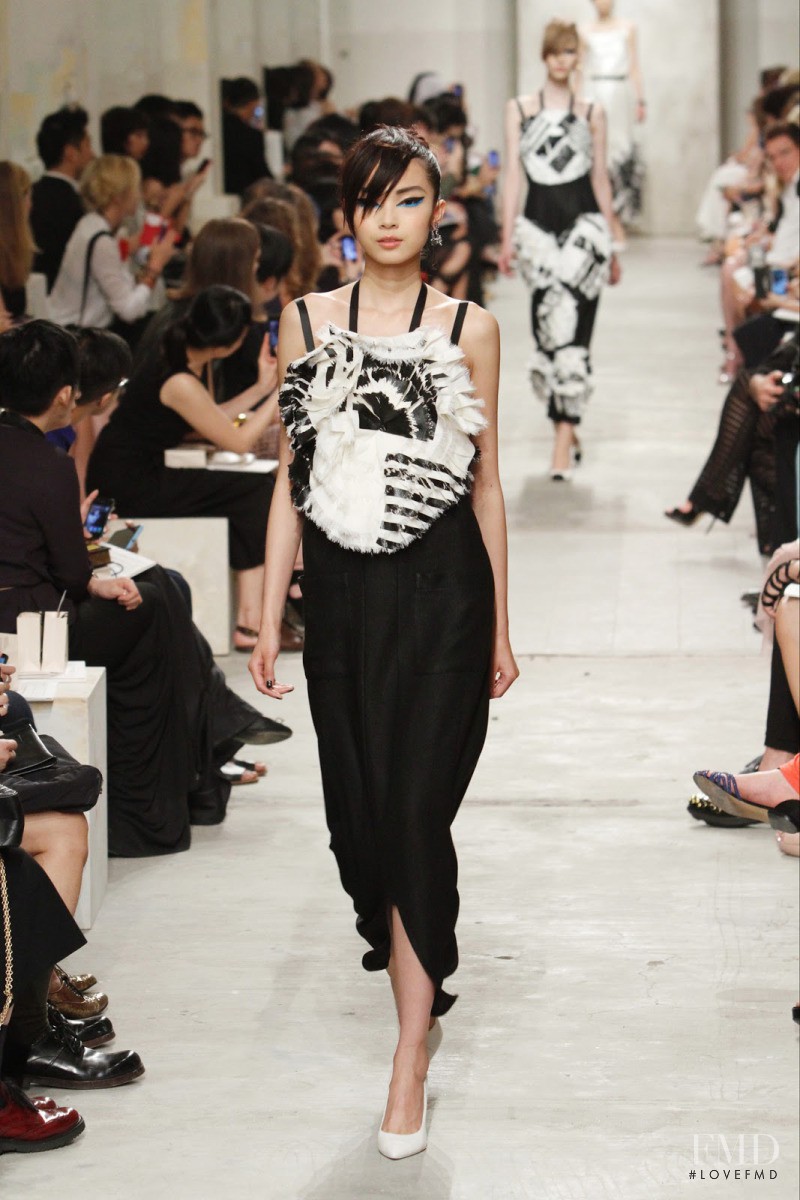 Xiao Wen Ju featured in  the Chanel fashion show for Cruise 2014