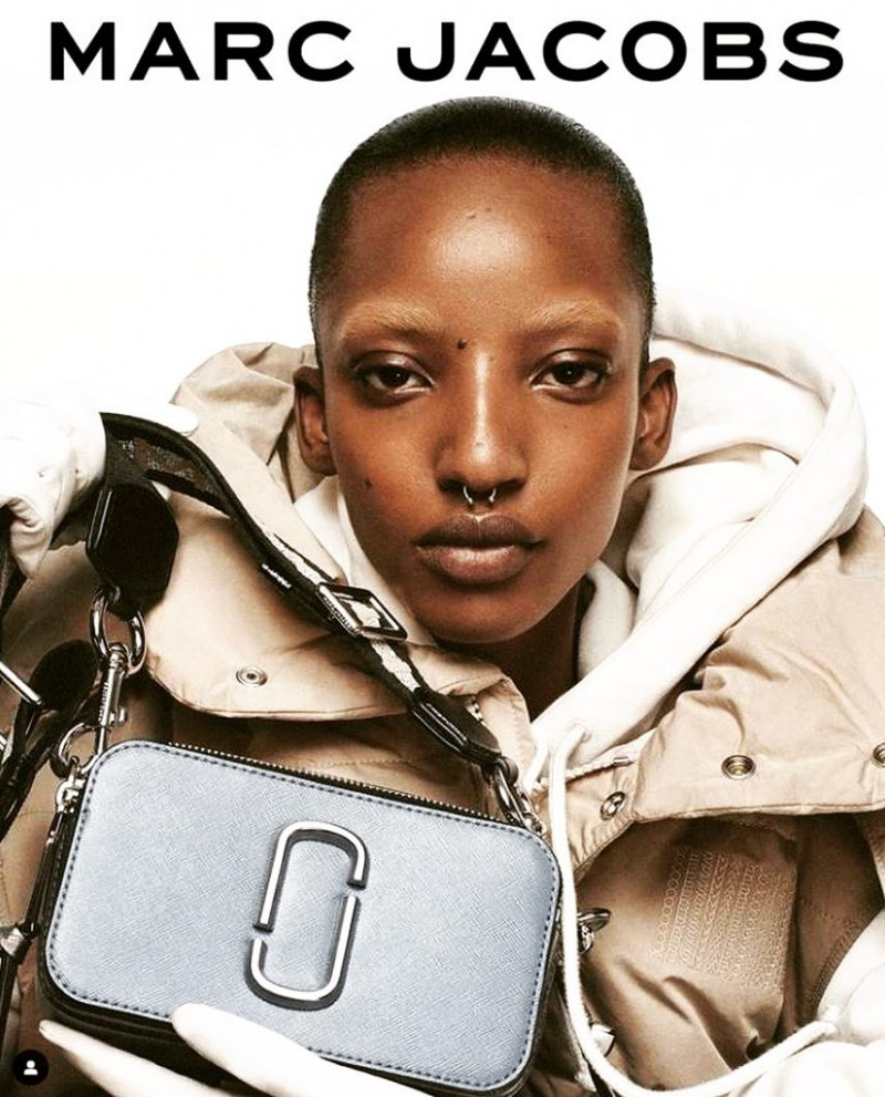 Divine Mugisha featured in  the Marc Jacobs advertisement for Resort 2022
