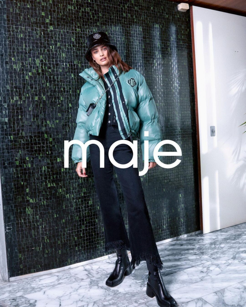 Taylor Hill featured in  the Maje advertisement for Winter 2022