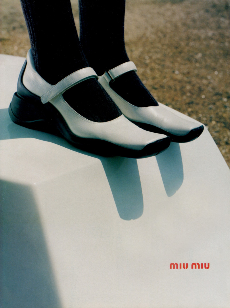 Sara Daykin featured in  the Miu Miu advertisement for Autumn/Winter 1998