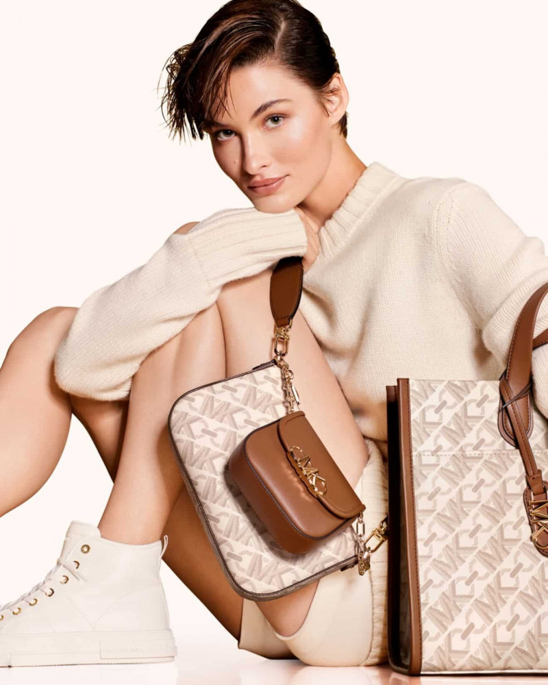 Grace Elizabeth featured in  the Michael Kors Collection Empire Signature Logo advertisement for Autumn/Winter 2023