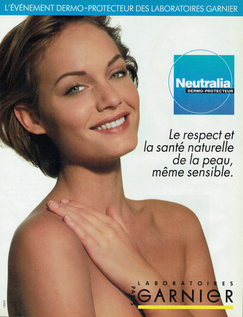 Amber Valletta featured in  the Garnier advertisement for Autumn/Winter 1992