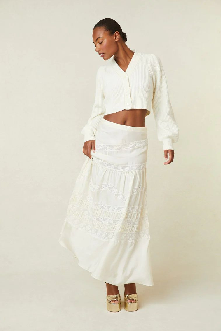 Ange-Marie Moutambou featured in  the LoveShackFancy catalogue for Spring/Summer 2024