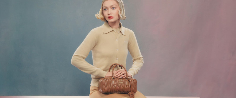 Gigi Hadid featured in  the Miu Miu Miu Miu Wander Handbag 2024 Campaign advertisement for Spring/Summer 2024