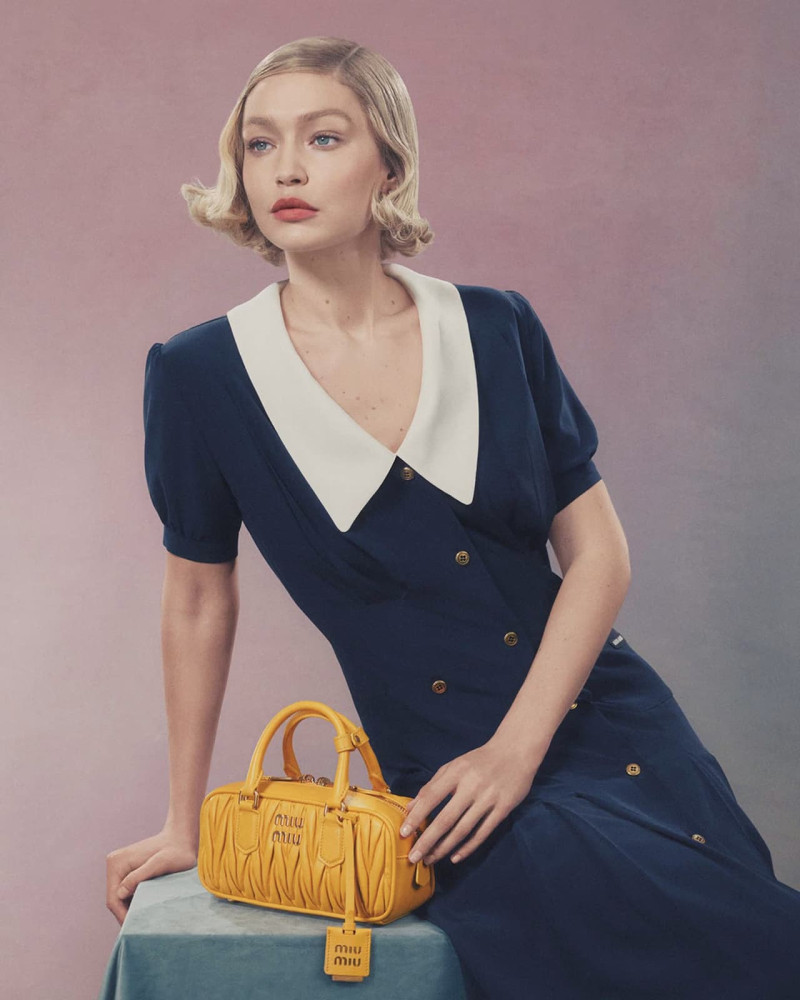 Gigi Hadid featured in  the Miu Miu Miu Miu Wander Handbag 2024 Campaign advertisement for Spring/Summer 2024