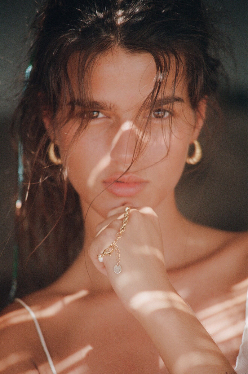 Paula Anguera featured in  the Sporty & Rich Jewelry advertisement for Spring/Summer 2023