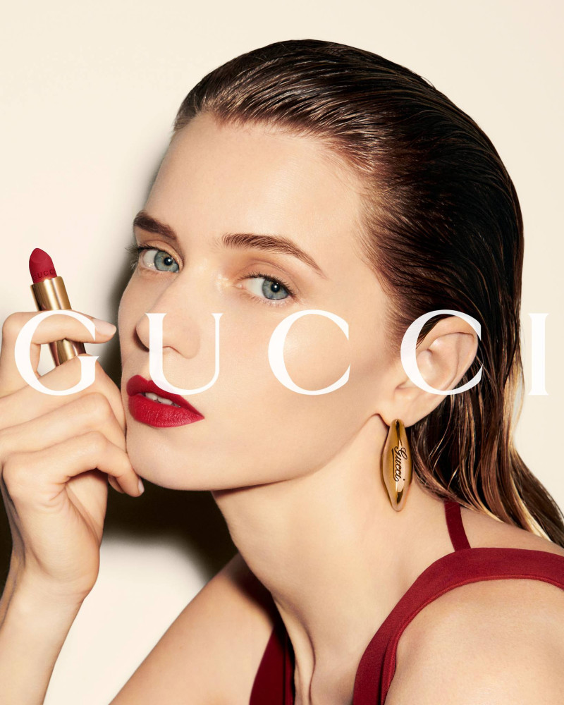 Abbey Lee Kershaw featured in  the Gucci Beauty Gucci Rosso Ancora 2024 Campaign advertisement for Summer 2024