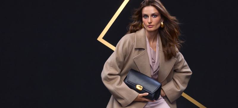 Andreea Diaconu featured in  the Donna Karan New York advertisement for Holiday 2024