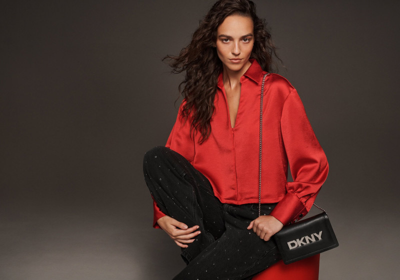 Emm Arruda featured in  the DKNY advertisement for Holiday 2024