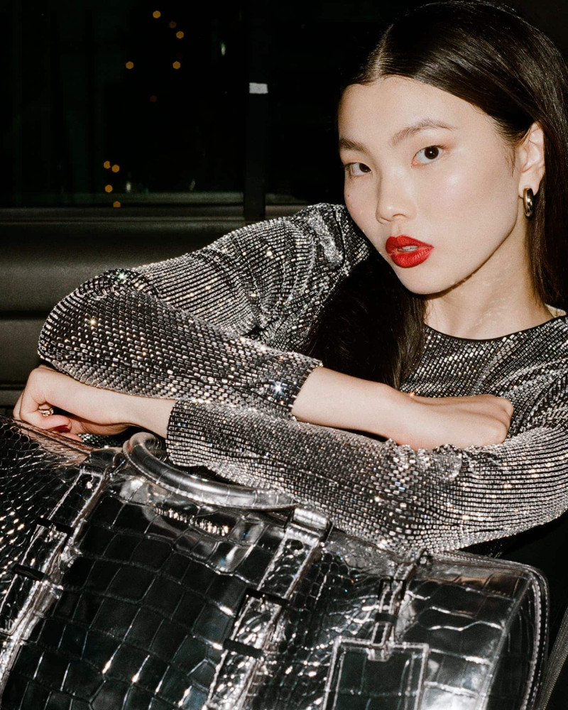 Sherry Shi featured in  the Michael Kors Collection It’s Lit advertisement for Holiday 2024