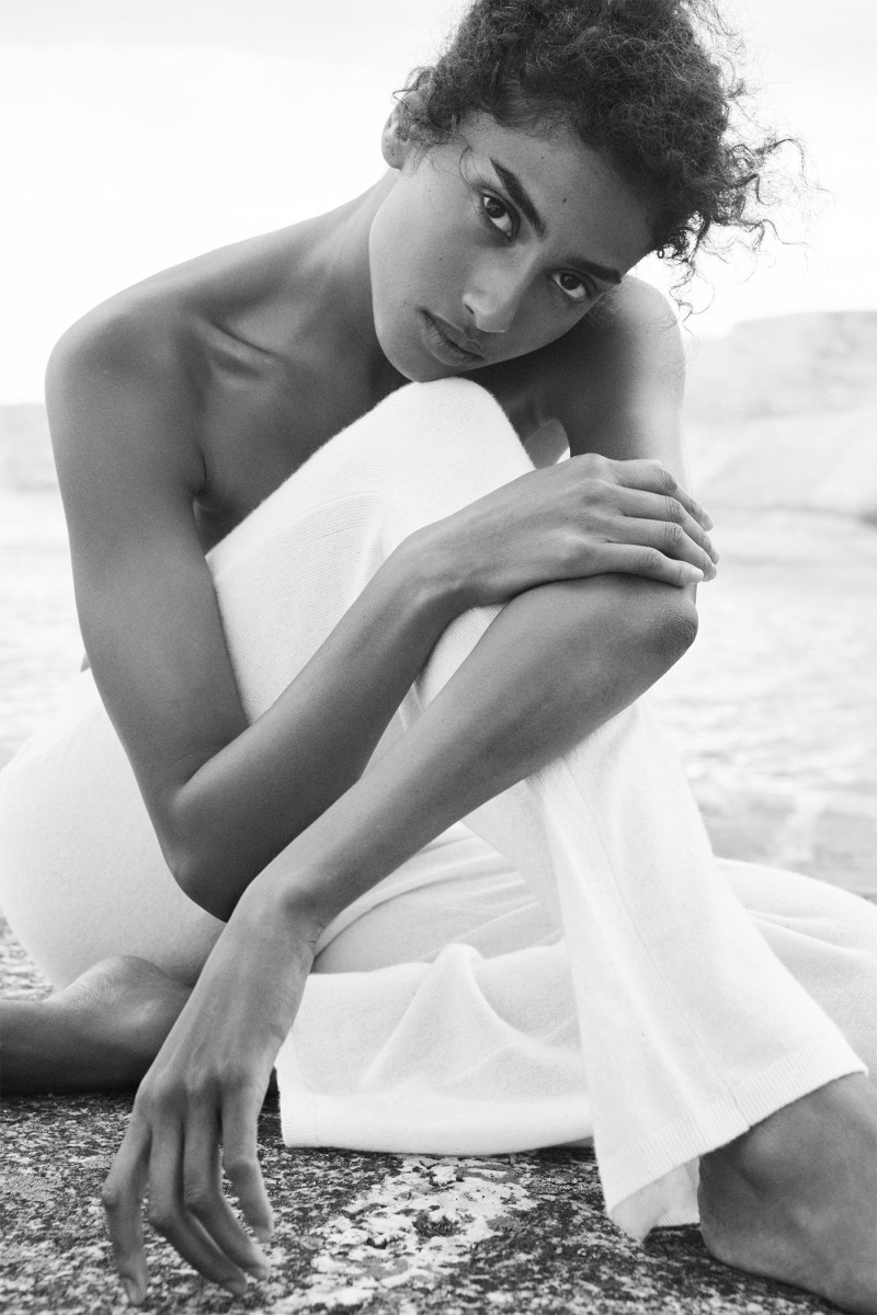 Imaan Hammam featured in  the DKNY Cashmere Mist Collection advertisement for Spring 2025