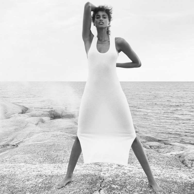 Imaan Hammam featured in  the DKNY Cashmere Mist Collection advertisement for Spring 2025