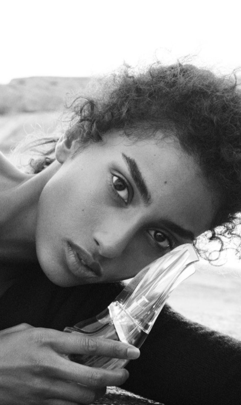 Imaan Hammam featured in  the DKNY Cashmere Mist Collection advertisement for Spring 2025