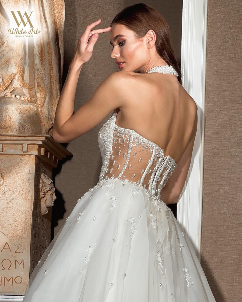 Alexandra Pletnyova featured in  the White Art Bridal lookbook for Winter 2022
