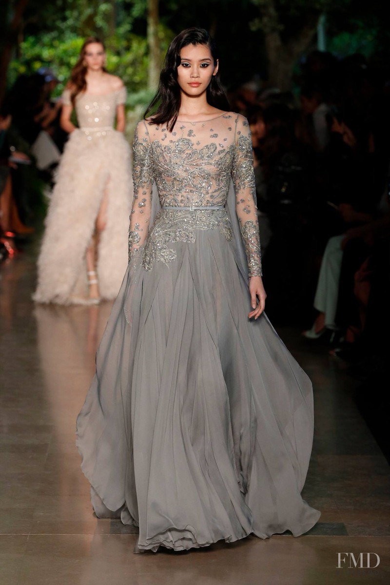 Ming Xi featured in  the Elie Saab Couture fashion show for Spring/Summer 2015